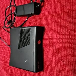 Xbox 360 plus 2 controllers plus cords plus kinect plus 4 games